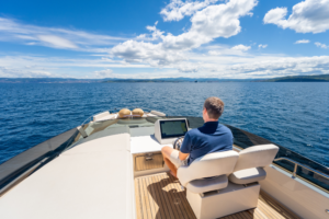 Crew member staring into the distance whilst at sea