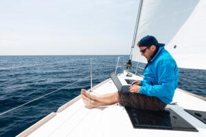 Man working on sail yacht