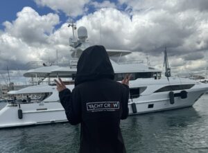 Yacht Crew Maya from Recruitment & Training, waving at yacht
