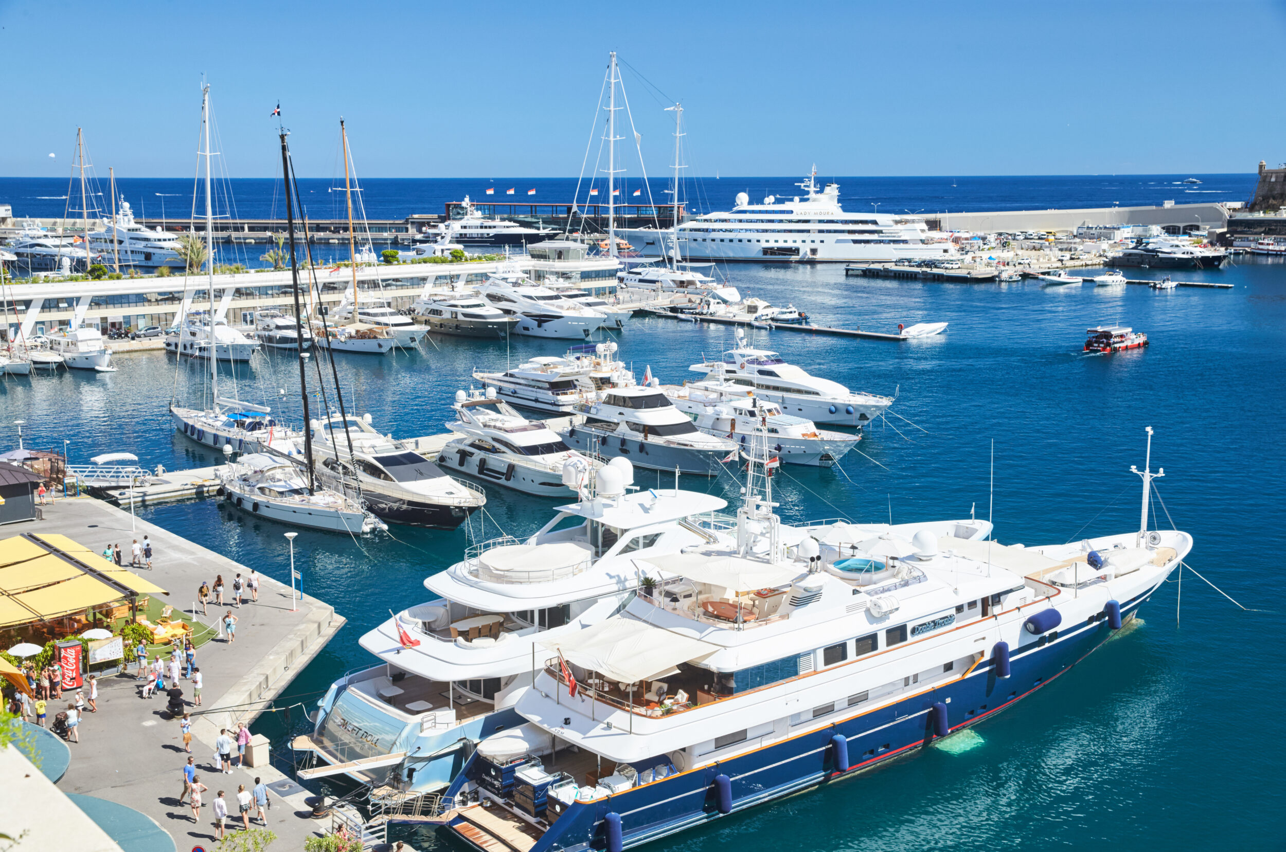 Monaco, Monte-Carlo, Monaco Ville, 8 August 2016: Port Hercules, the preparation of the yacht show MYS, sunny day, many yachts and boats, RIVA, Prince's Palace of Monaco, megayachts, Massif of houses