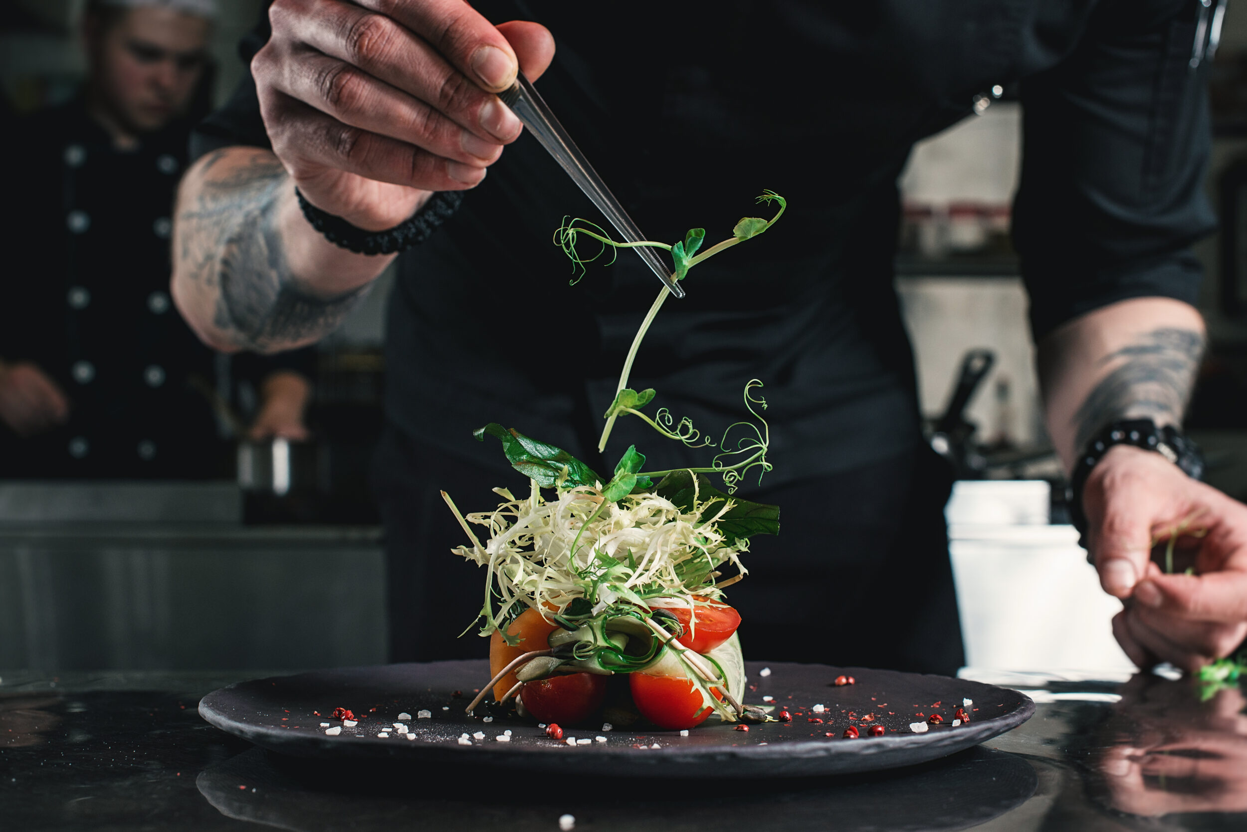 Chef plating and decorating food on a yacht